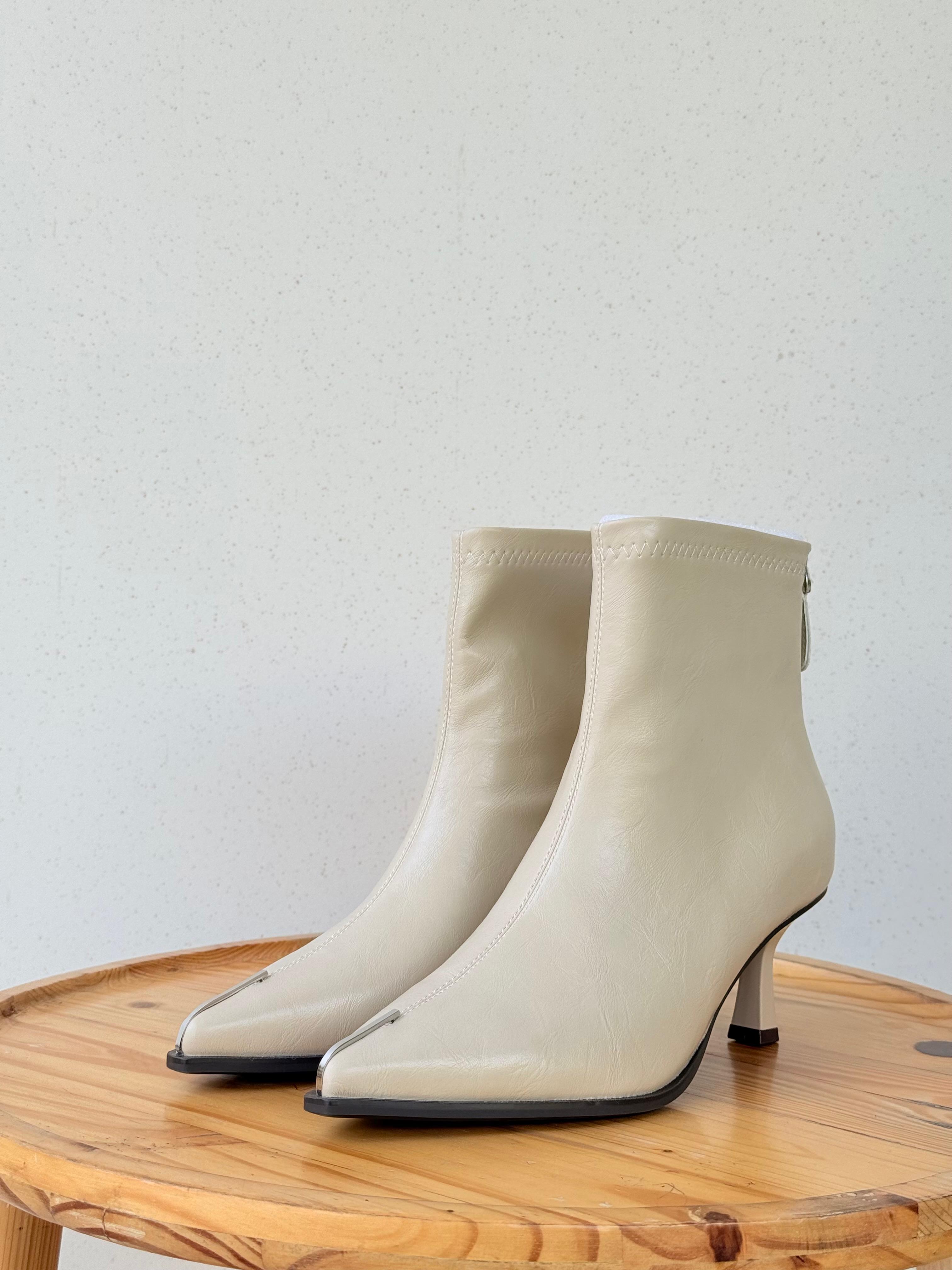 Pointed metal detail ankle boots