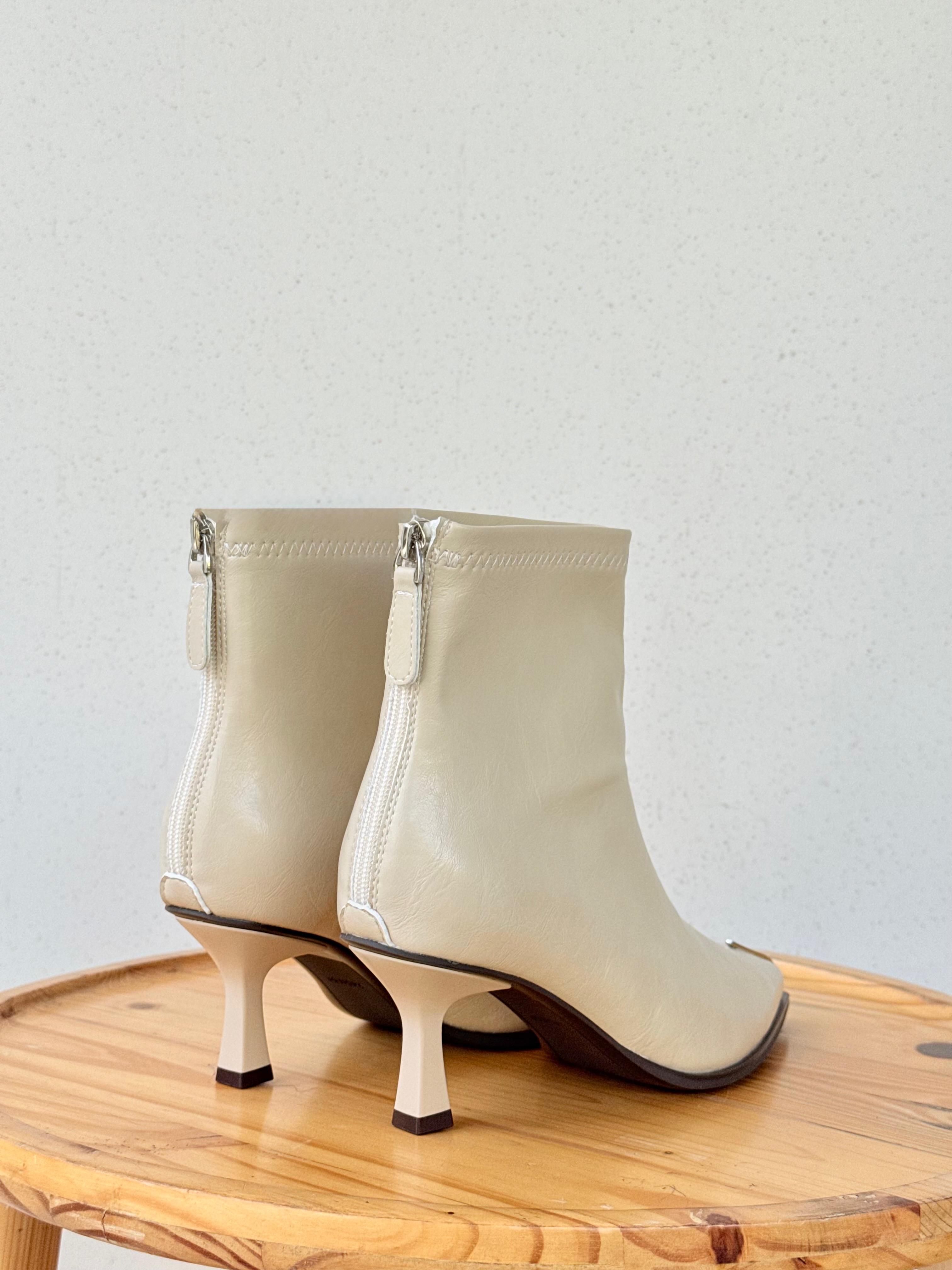 Pointed metal detail ankle boots